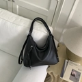 Chic black oversized hobo bag in textured leather with tassel zipper and silver hardware - Black without Pendant