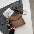 Brown leather bucket crossbody bag with woven handle and cute rabbit doll pendant - With Pendant / Brown