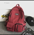 Dettaglio dello zaino scolastico in nylon rosso vino con tasche tattiche e logo Ladata - Rosso Vino (Senza Ciondolo)