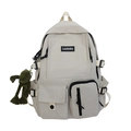 Minimalist cream canvas school backpack with Ladata logo and a green frog plush charm - White With Frog Pendant