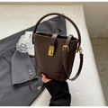 Retro dark brown bucket bag with gold lock and matte leather in a city style - Coffee