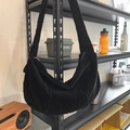 Minimalist black corduroy half-moon crossbody bag with ribbed texture and wide strap - Black
