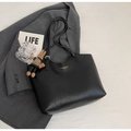 Macro shot of a black leather tote bag with a brown rabbit charm on white background - With Pendant / Black