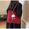 Detail of red crinkled patent leather tote bag with creative cloud plush charm - Single Bag / Burgundy