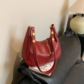 Fashionable red hobo underarm bag with gold rivets and smooth glossy leather finish - Red