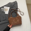 Minimalist dark brown bucket bag with gold lettering logo on vintage leather texture - No Pendant / Coffee