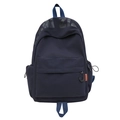 Dark blue minimalist nylon backpack for students featuring orange brand tag - Dark Blue