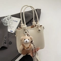 Chic beige lychee grain bucket bag with knotted handle and cute bear bag charm - With Plush Bear Pendant / White