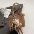 Brown litchi grain leather bucket bag with a knot handle and cute bear charm detail - With Plush Bear Pendant / Khaki