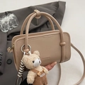Glossy light brown square handbag with double handles and a cute bear bag charm accessory - Apricot With Overalls Bear