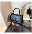 Detail of black glossy crackle leather handbag with metallic ring buckle and top handle - One Size / Black