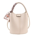 Chic beige lychee textured bucket bag with decorative silk scarf and cross-body strap - White