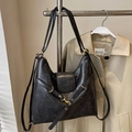 Retro dark grey tote bag with soft leather texture and golden metal hardware details - Black