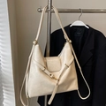 Minimalist creamy white soft leather tote bag with adjustable strap and metal hardware - Off White