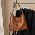 Brown vintage faux leather tote bag with a minimalist design and golden hardware finish - Brown