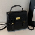 Small black embossed handbag with cartoon pattern and gold logo plaque detail - Black - Without Pendant
