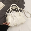 Chic cream white leather pillow bag featuring a delicate lace bow and top handles - No Pendant / White