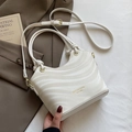 Elegant cream wave-textured bucket bag with dual handles and gold-tone hardware detail - Off-white - No Pendant