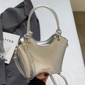 Borsa a secchiello argento lucida con manico annodato e tracolla regolabile in stile life - Senza Ciondolo / Argento