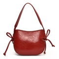 Minimalist burgundy red oily leather bucket bag with side bow tie and wide strap - Red