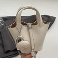 Cream lychee leather bucket bag with silver hardware, heart charm and chain strap - Rice White With Heart Charm