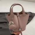 Pink lychee texture bucket bag with silver chain strap and padlock charm accessory - Pink With Heart Charm