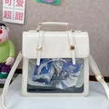 Minimalist beige ita bag with transparent window and adjustable straps for crossbody wear - White