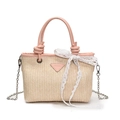 Beige woven straw tote bag with pink handles, logo patch, and silver chain strap - Pink
