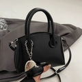 Minimalist black glossy leather handbag with CLEAR heart charm and shoulder strap - Black With Heart Charm