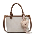 Contrast bucket bag in beige and dark brown with a bear charm and woven cord detail - Creamy White + Bear Charm