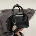 Glossy black bowling bag with silver heart charm and chain handle in elegant setup - Black (With Heart Charm)