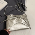 Metallic silver ballet-style shoulder bag with large bow detail and chain strap - Silver