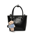 Minimalist black bucket bag in glossy leather finish with cute plush bear keychain - Black With Blue Sweater Dog