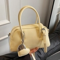 Chic cream yellow small boston handbag with dual handles and logo detail for women - Yellow (With Heart Pendant)