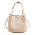 Elegant cream white bucket bag with pebble leather texture and silver hardware accents - White without Pendant