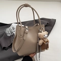 Minimalist beige bucket bag in lychee pattern leather with a cute plush bear charm - Khaki With Bear Charm