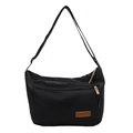 Bolso tote negro minimalista de lona con correa ajustable y detalle de parche de cuero - Negro
