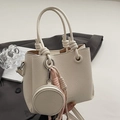 Chic beige lychee leather bucket bag with knotted handle and round coin purse charm - With Matching Color Round Purse and Knot Decor / White