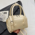 Beige faux leather crossbody pillow bag with silver hardware and top handles - Off-white - No Pendant