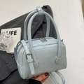 Light blue PU leather pillow bag with double handles and adjustable strap for women - Light Blue (Without Charm)