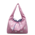Sac cabas en toile rose avec motifs de lettres blanches et nœud à rayures bleues - Rose