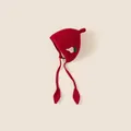 Red knit earflap beanie for toddlers with strawberry patch and leaf tie detail - One Size: Head Circumference 42-48cm / Red