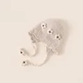 Beige baby knitted earflap hat with handcrafted white crochet flowers for winter warmth - One Size / Beige