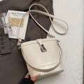 Creamy white bucket bag with silver twist lock and dual adjustable shoulder straps - Off-White (Without Pendant)