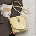 Chic cream-colored leather bucket bag with metal buckle and dual strap design - Yellow (No Pendant)