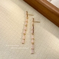 Elegant long linear tassel earrings featuring pale pink stones in gold-plated settings - Lotus Pink