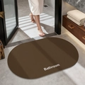Dark brown oval bathroom mat with non-slip texture and white Bathroom text detail - Plain (oval) - Dark Brown