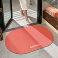 Oval non-slip bathroom mat in warm orange with Bathroom text and woven texture - Plain (oval) - Plum Pink