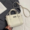 Mini borsa a secchiello bianco crema con trama a grana di litchi e tracolla - Bianco senza Pendente