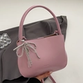 Pink PU leather bucket bag with top handle and decorative beaded bow charm - Rose Pink (With Bow & Key Charm)